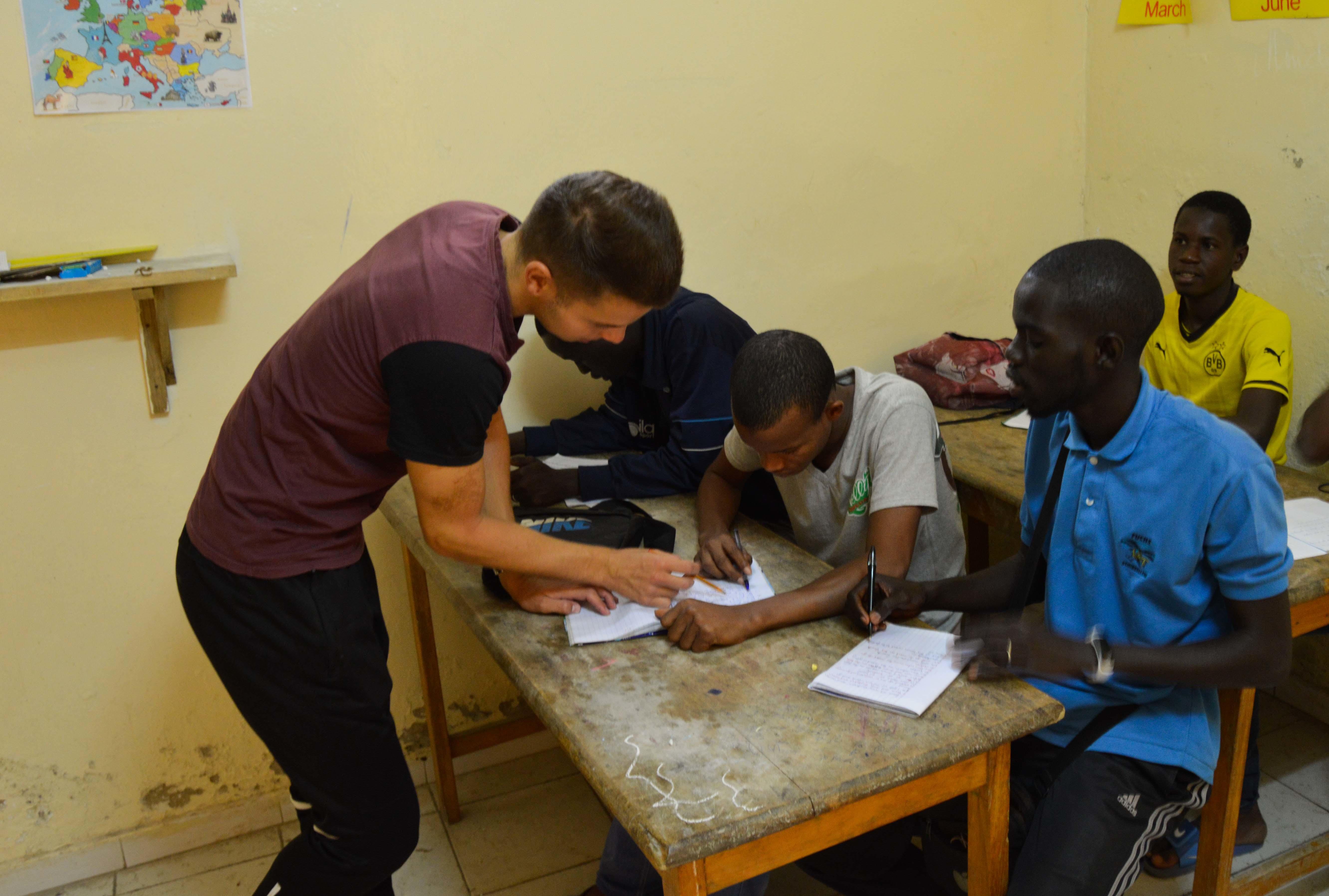 A Projects Abroad volunteer speaks to children at a placement in Senegal A volunteer works with Talibe boys as part of his volunteer work for teenagers in Senegal